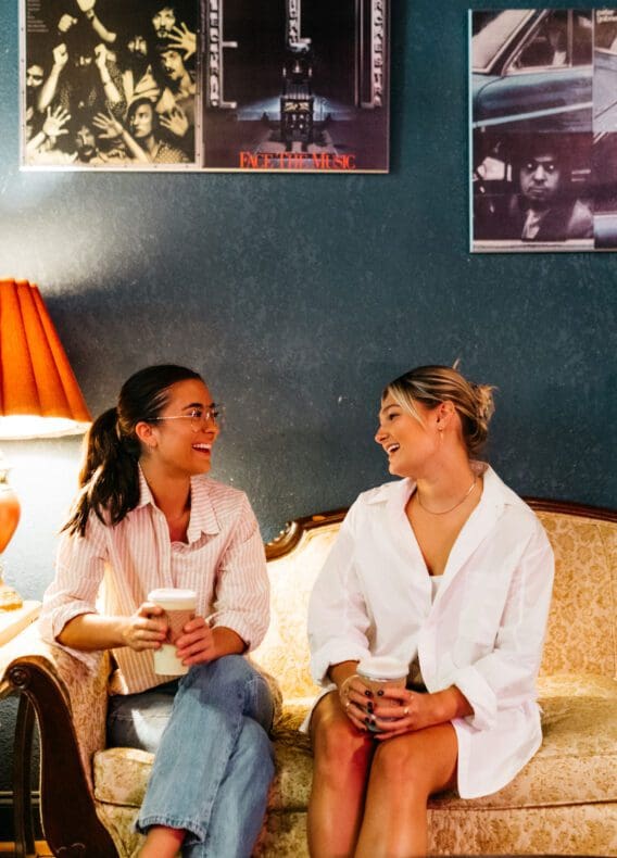 Two girls who attend UGA in Athens Coffee shop.