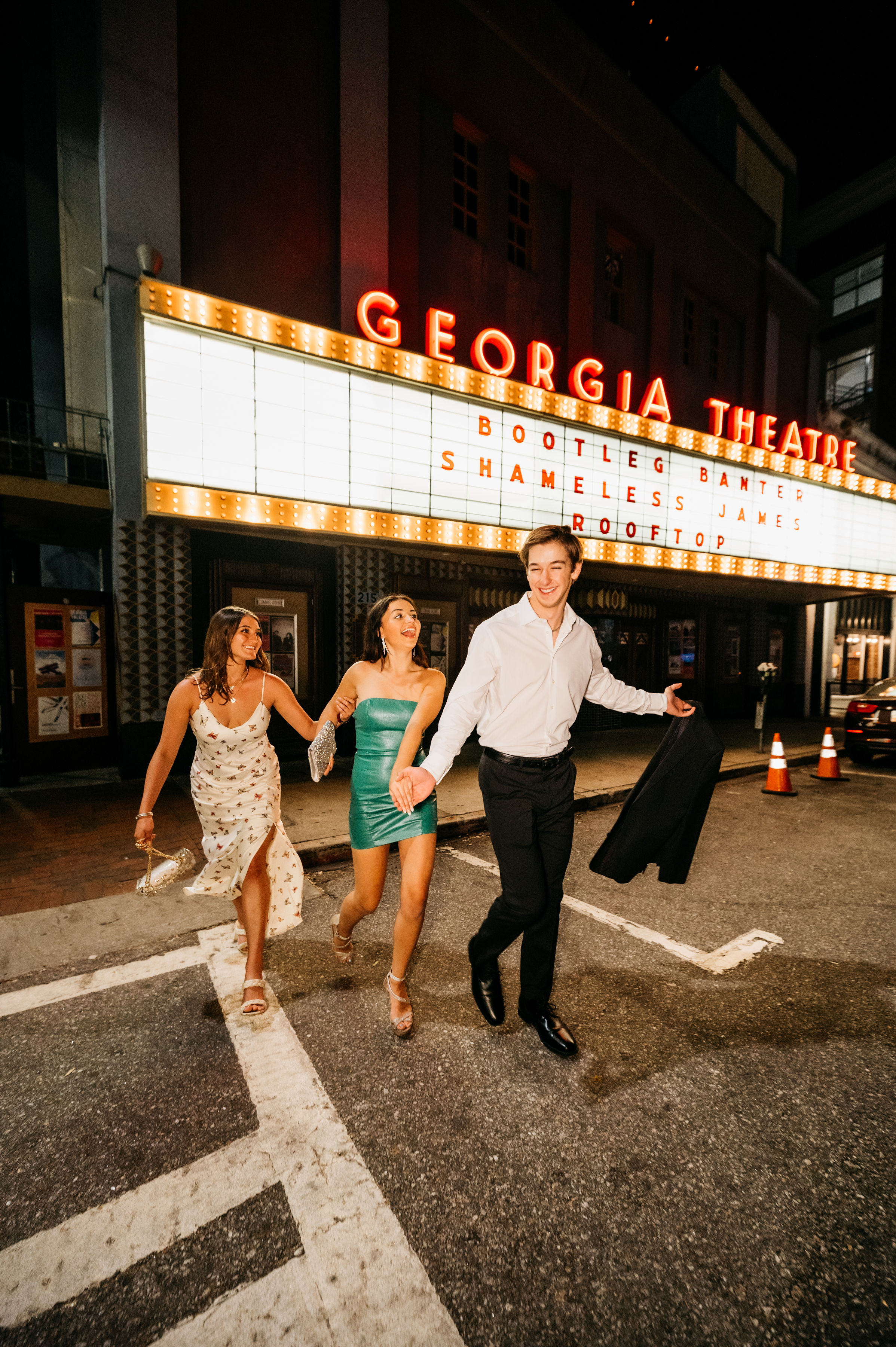 friends walking in front of Georgia Theatre 