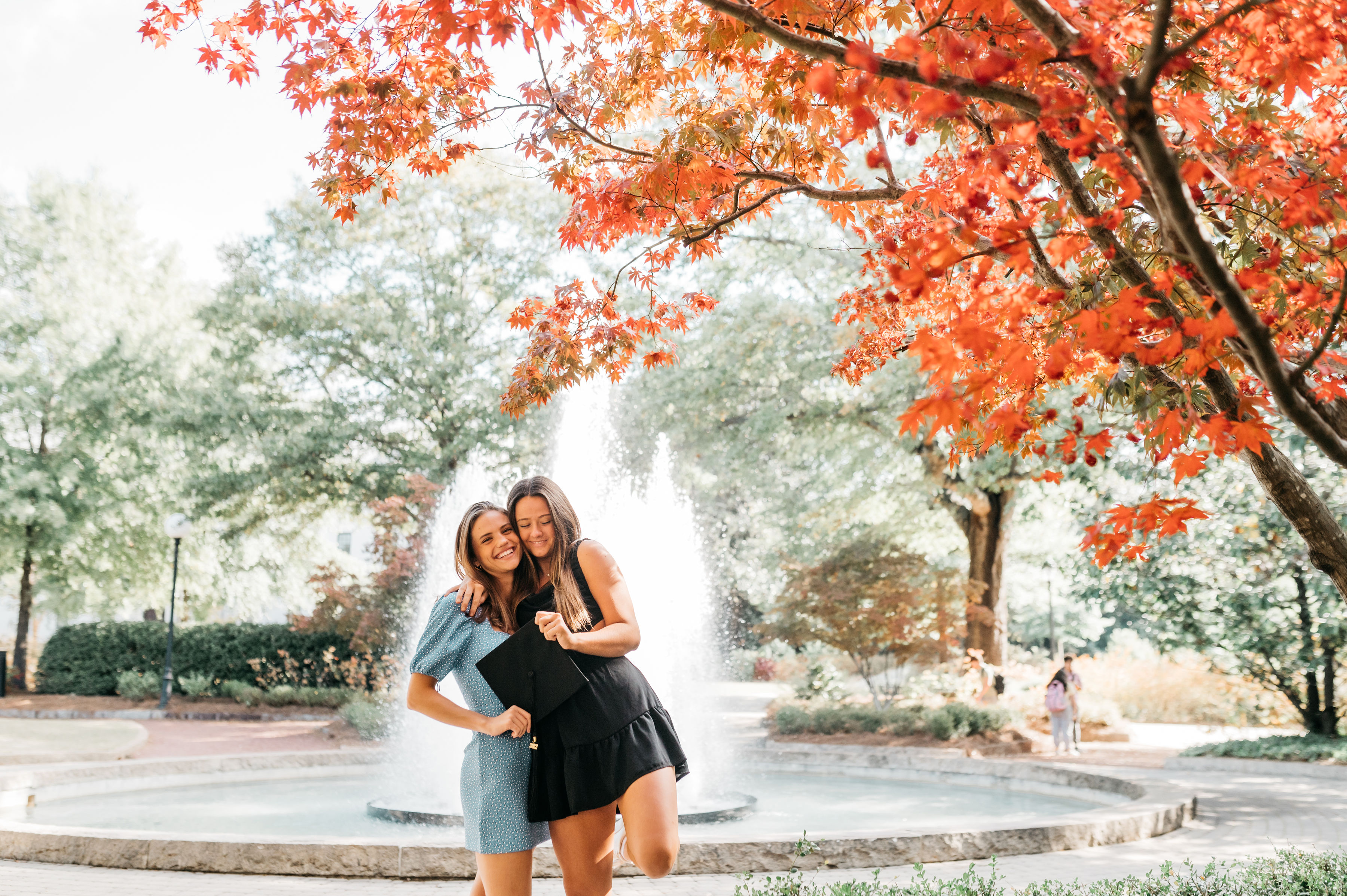 photo of two friends in front of Herty Fountain