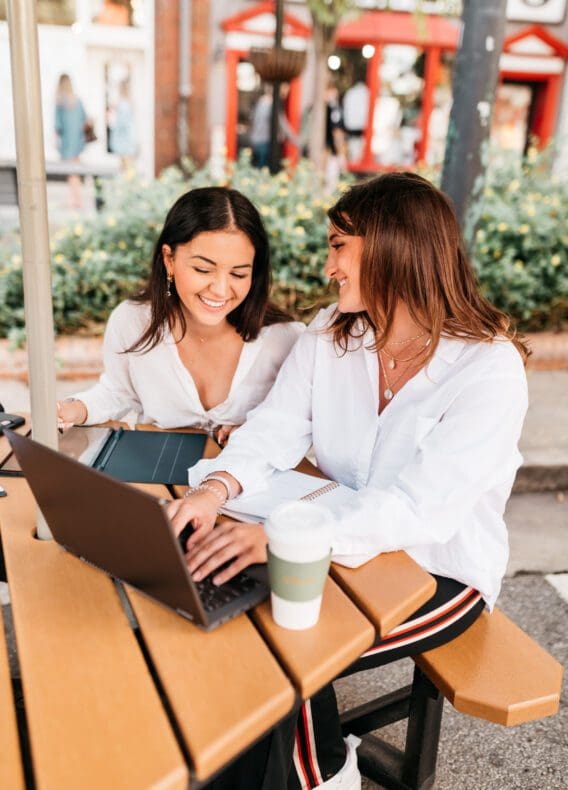 Friends laughing over a coffee at UGA