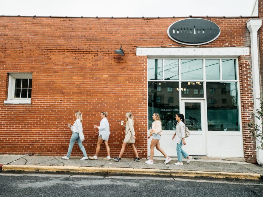 Four UGA students walking in Downtown Athens.