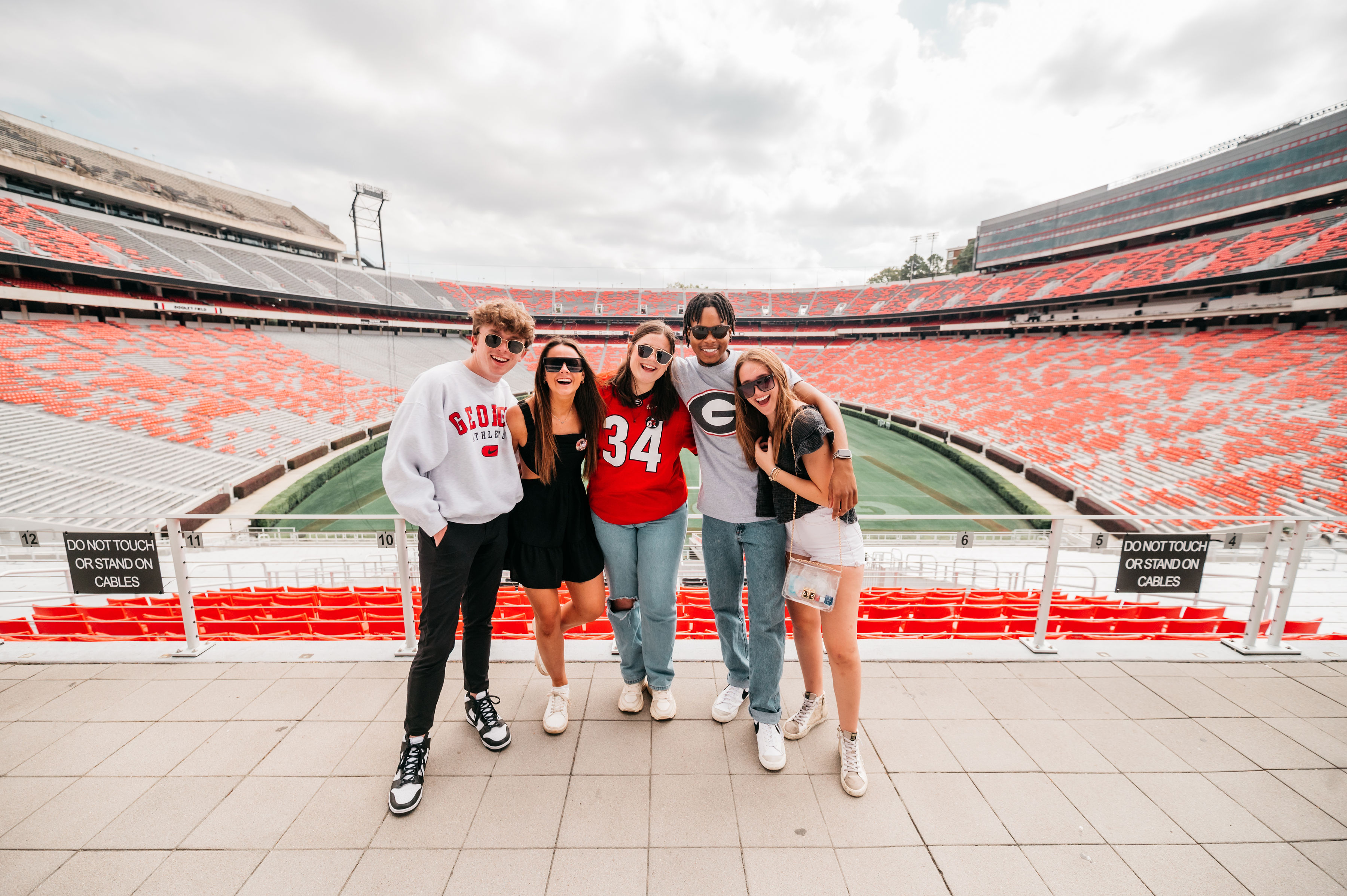 friends outside Sanford Stadium