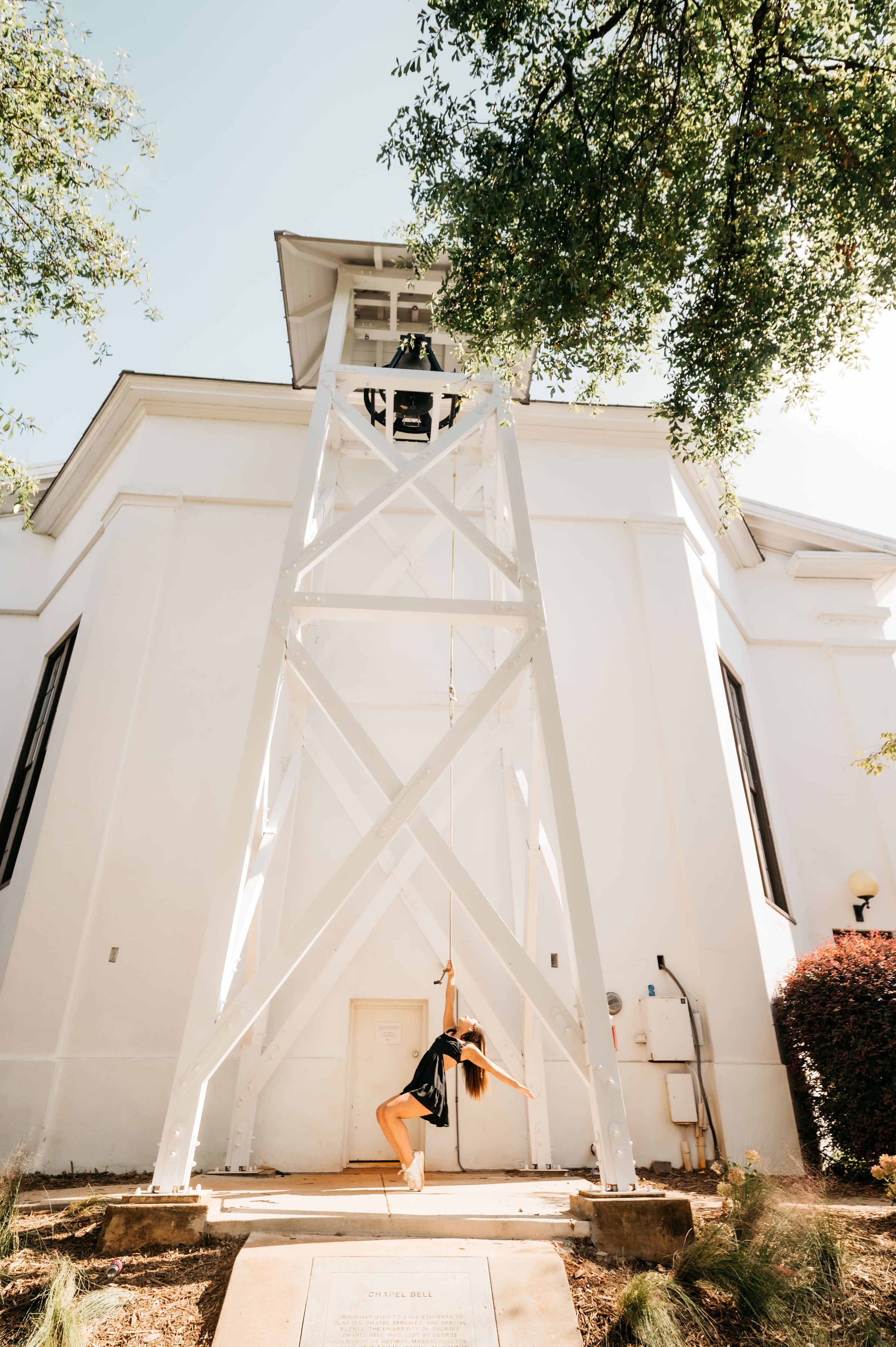 a girl swinging on the Chapel Bell 