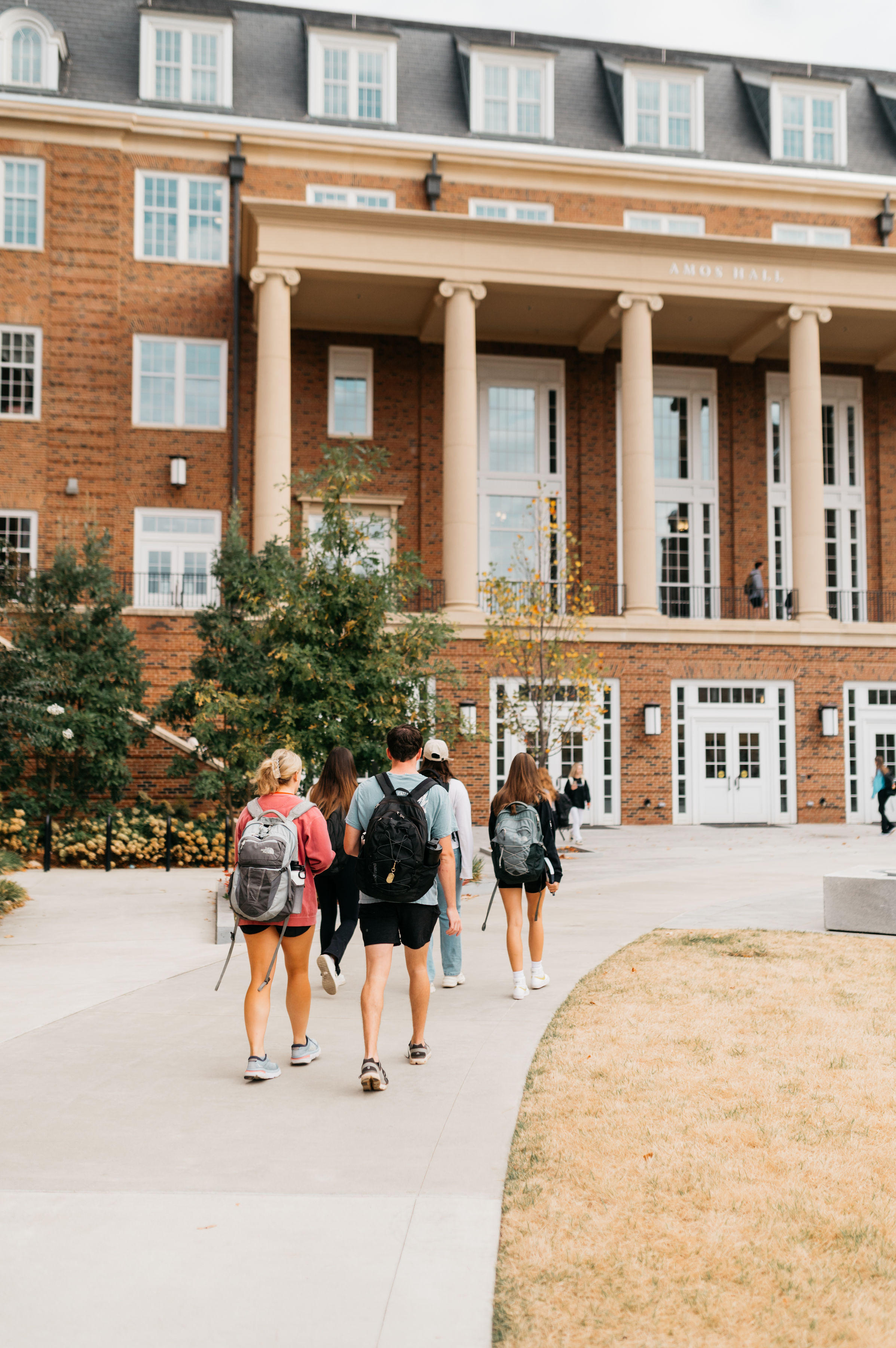 students walking up to Terry College of Business in Athens 