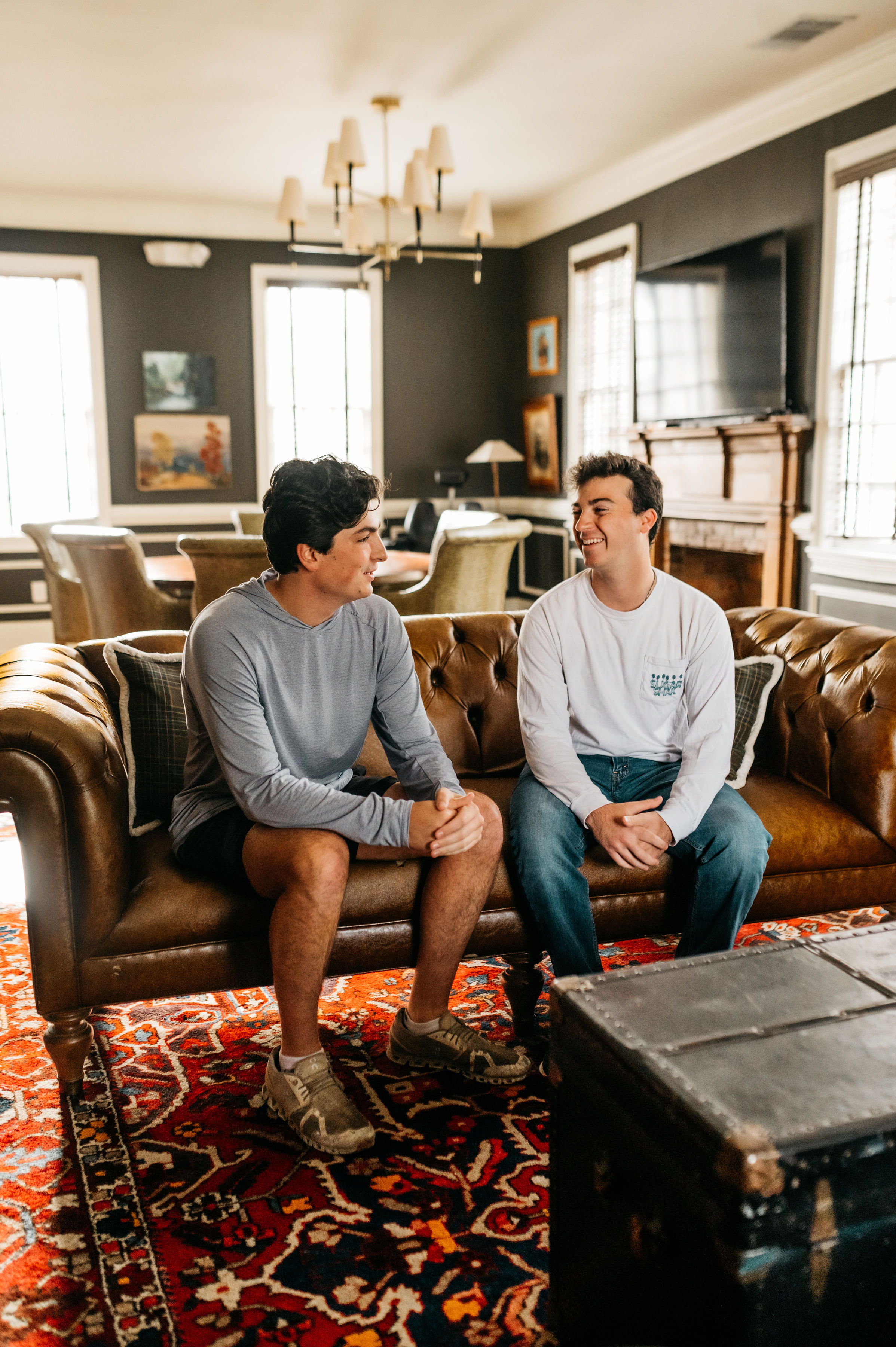 two guys sitting on a couch in Athens