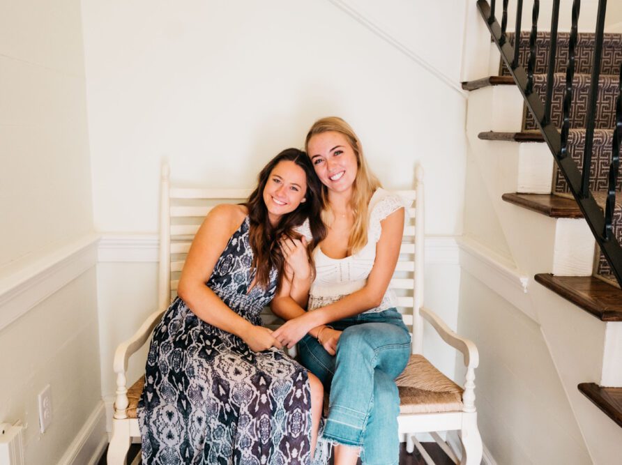 friends sitting on a bench inside