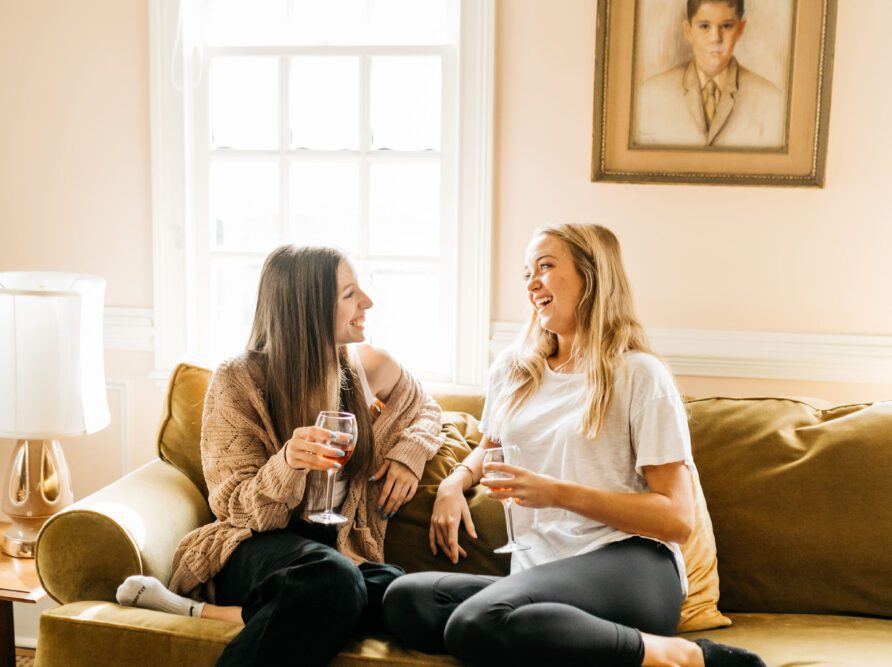 girls on their couch together in an apartment in Athens