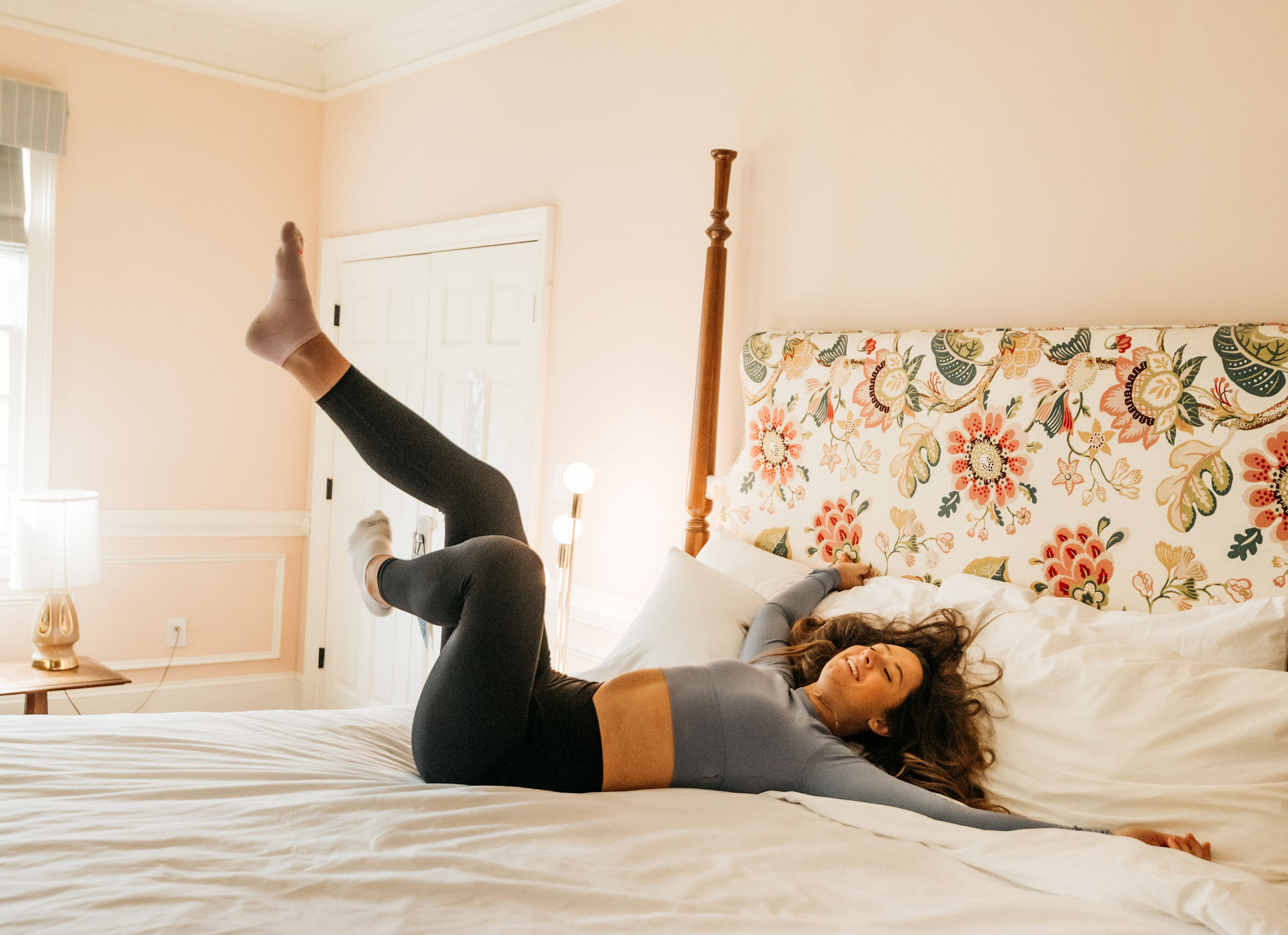 girl on her bed in an apartment