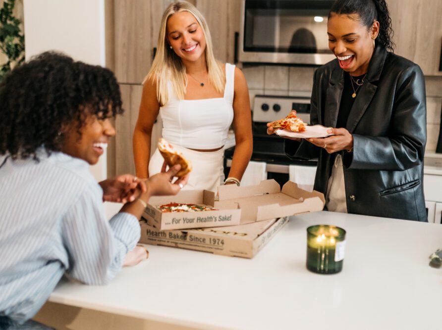 Friends eating in kitchen 