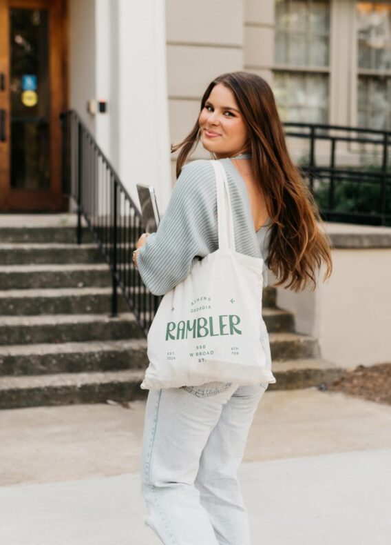 girl walking with a rambler tote