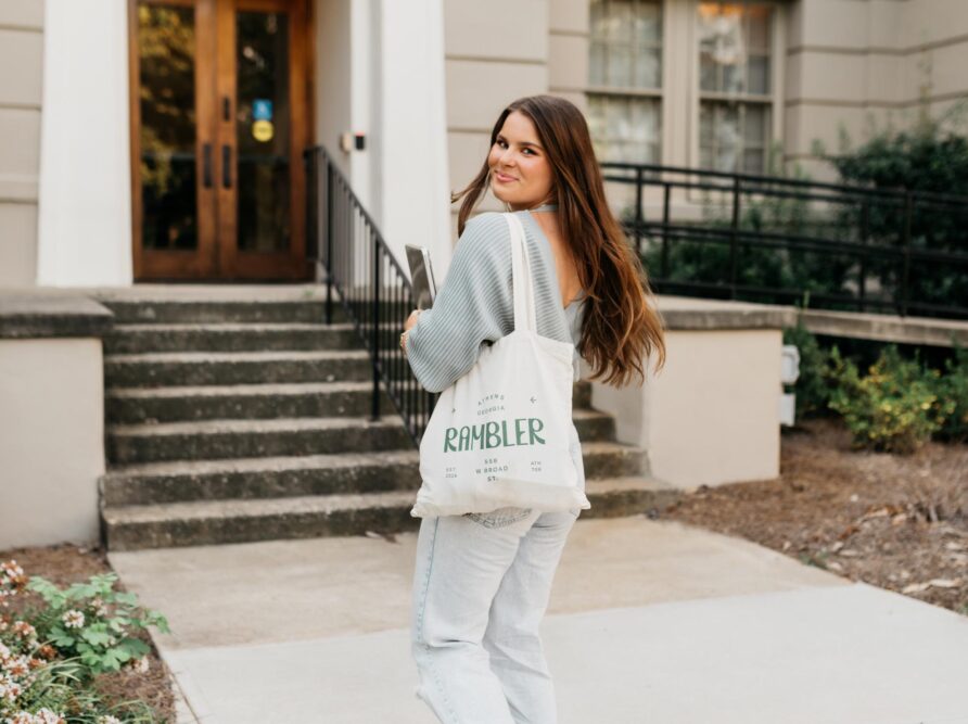 girl walking with a rambler tote