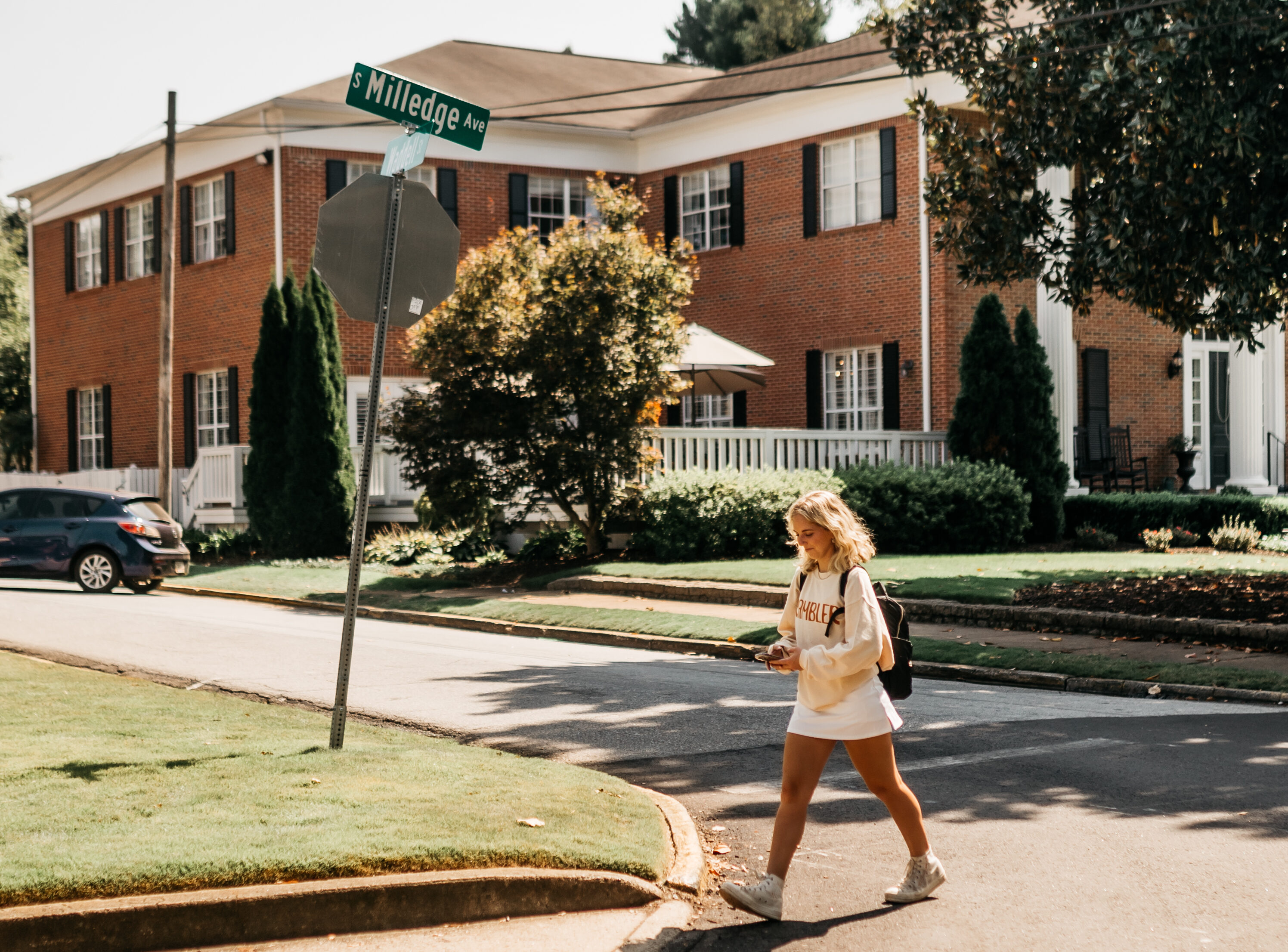 Girl walking down Milledge Ave