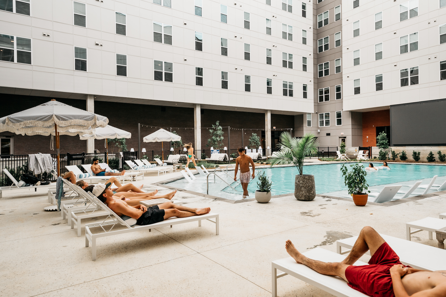 Wide view of students out at the pool at Rambler Athens